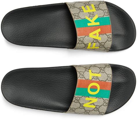 Shop Gucci Pursuit Fake Slides 